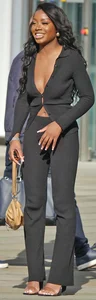 Slim ebony teens in leggings posing in the sun