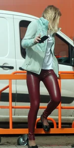 Girl in Red Leather Leggings Sitting on a Street Fence Creepshots Gallery