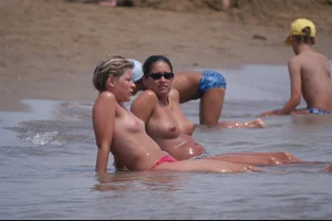 Girls on a nude beach in Bibione, Italy