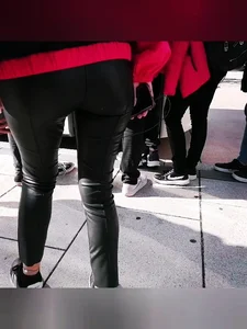 Ass in leather pants closeups on the street