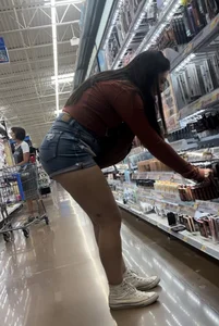 Sexy Latina bends over in front of me