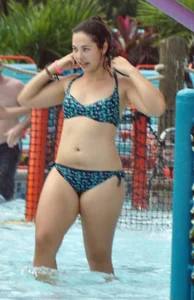 Thick brunette in a bikini while in the pool