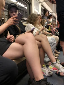Hot Girls in a Subway Train Sitting With Crossed Legs Closeups And Flashing Booties Under Skirt
