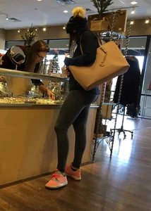 Brunette jewelry shopping in leggings with a nice ass
