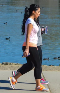 Thick lady walking in leggings with a big booty