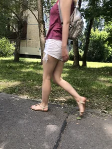 Candid chick in shorts and sandals passing by