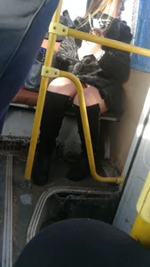 Girl in High Boots Sitting in a Bus in Pantyhose with Her Panties Visible