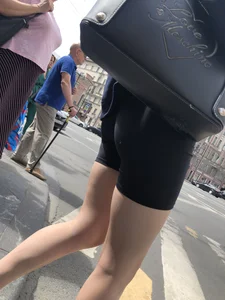 Great legs and booty in spandex shorts of a street candid girl crossing the street
