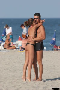 A bunch of sexy beach voyeur babes in bikinis, thongs and topless