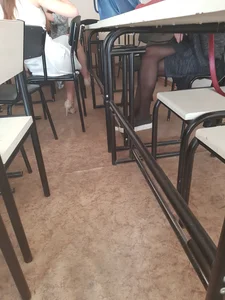 Crossed College Girl’s Legs in Black Pantyhose Under a Desk Classroom Creepshot