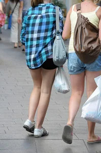 Pretty blonde and brunette friend walking in shorts
