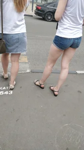 Girl in Denim Shorts and Sandals City Creepshot