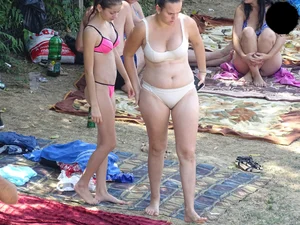 Beautiful and sexy teen in pink thong bikini