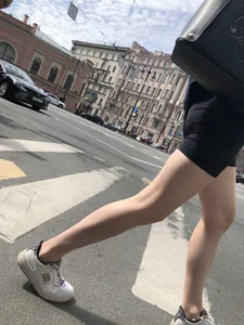 Great legs and booty in spandex shorts of a street candid girl crossing the street