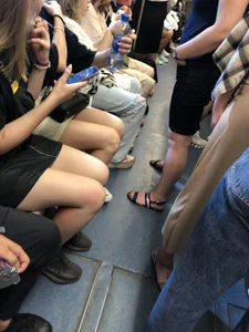 Hot Girls in a Subway Train Sitting With Crossed Legs Closeups And Flashing Booties Under Skirt