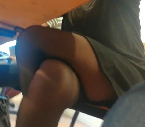 Under Table Creepshot of a College Girl in Classroom Sitting with Her Legs Crossed