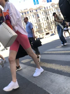 Awesome booty in spandex shorts, candid girl on a sidewalk