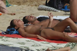 Topless girls on a beach in Barcelona