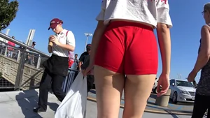 Red short shorts teen cheeks out. walking in mall