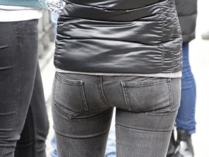 Cute petite girl in tight black jeans