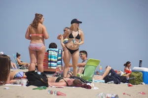 Two thick white girls in bikinis on the beach with big asses