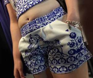 Cute Girl in Gzhel Patterned Top and Shots With Chunky Tummy and Hot Legs at the Clothing Store
