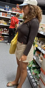 Curly haired woman with huge tits and nice legs