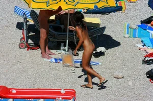 Ula FKK Sexy brunette on a nude beach topless, bottomless and with blue thong