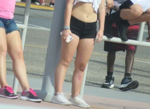 Couple of babes standing around in shorts