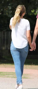 Blonde chick walking with her boyfriend in tight jeans