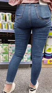 Brunette girl with nice ass sexy PAWG in tight jeans in a store