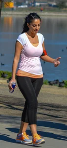 Thick lady walking in leggings with a big booty