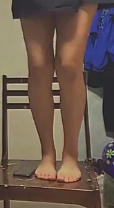 Closeup Creepshots of a Teen Girl's Legs And Bare Feet, Standing on Chair in a Skirt