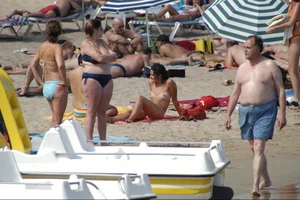Girls on a nude beach in Sitges, Spain