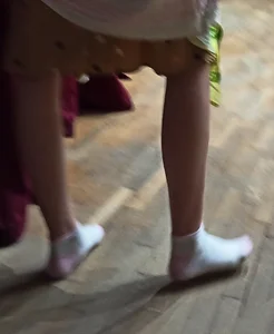Skinny Legs And Feet in White Socks of a Teen Candid Girl in a Dress