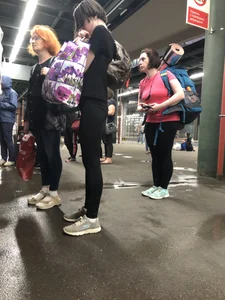 Teen Girl in Tights And Sneakers Standing on the Train Platform VPL Photos