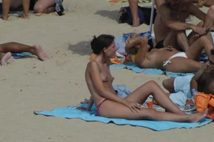 Topless girls on a beach in Barcelona