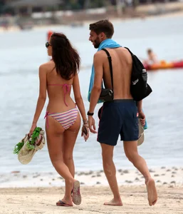 Curvy wide hipped and big bootied brunette on the beach