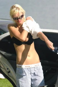Blonde babe changing into and out of bikini and shows her tits