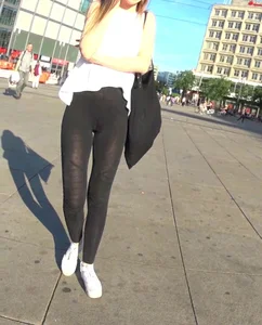 Beautiful skinny girl in see thru leggings with cameltoe