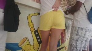 Milf in yellow shorts with vpl and a wedgie