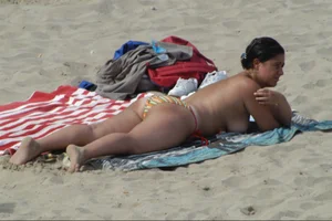 Girls on a nude beach in Sitges, Spain