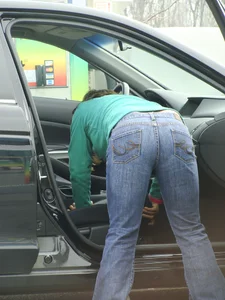 Girls cleaning their cars in jeans and pants