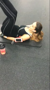 Sexy gym girl with a nice body in leggings as she works out
