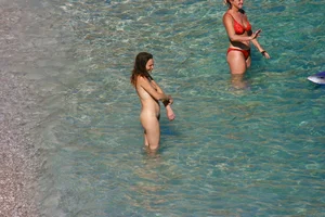 FKK Nudists playing in the water with floater