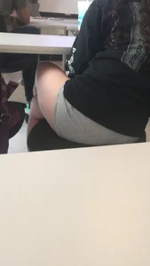 Candid Girl’s Crossed Legs Under the Table Closeup