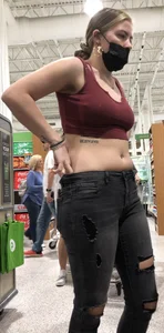 Latina in Maroon crop top and tight black jeans