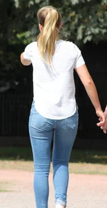 Blonde chick walking with her boyfriend in tight jeans