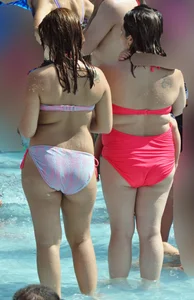 Two thick milfs at the pool in bikinis