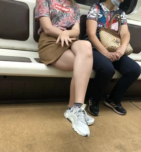 Amazing Hot Girl in a Skirt and Sneakers Sitting Cross-Legged in the Subway Train and on the Escalator Candid Photos Gallery